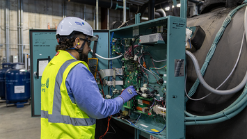 man working on machine repair